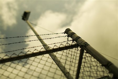 simsearch:600-06325427,k - Barbed Wire Fence Stock Photo - Rights-Managed, Code: 700-00182530