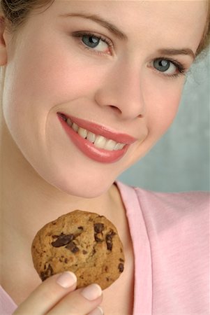 simsearch:700-00182617,k - Woman Holding Cookie Stock Photo - Rights-Managed, Code: 700-00182618