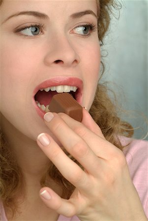 Woman Eating Chocolate Stock Photo - Rights-Managed, Code: 700-00182621