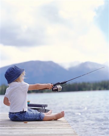 Little girl fishing pole Stock Photos - Page 1 : Masterfile