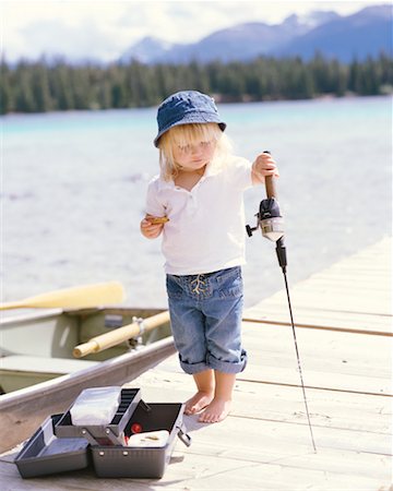 Picture of a little girl holding fishing rod Stock Photos - Page 1