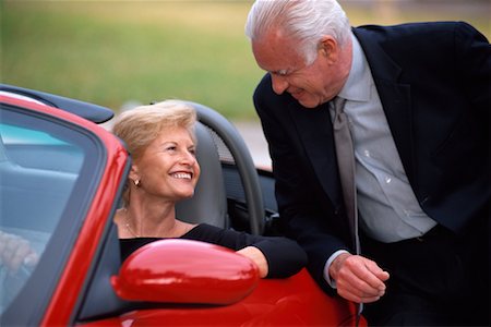 Man Talking to Woman in Sports Car Stock Photo - Rights-Managed, Code: 700-00194002