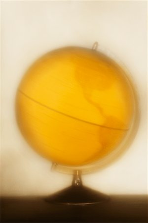 simsearch:700-00096399,k - Yellow Spinning Globe Foto de stock - Con derechos protegidos, Código: 700-00194283