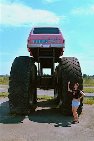 Woman Standing by Monster Truck Stock Photo - Rights-Managed, Code: 700-00194419