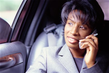 simsearch:700-00195272,k - Femme sur le téléphone en limousine Photographie de stock - Rights-Managed, Code: 700-00195273