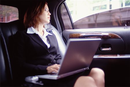 Business Woman with Laptop in Limousine Stock Photo - Rights-Managed, Code: 700-00195280