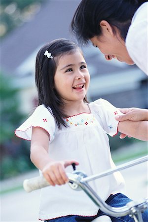 Mother Talking to Daughter on Bike Stock Photo - Rights-Managed, Code: 700-00196145