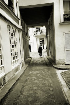 paris in black and white - Man Walking Down Lane Stock Photo - Rights-Managed, Code: 700-00196174