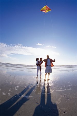 Family Flying Kite on Beach Stock Photo - Rights-Managed, Code: 700-00196394