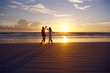 Couple on Beach at Sunrise Stock Photo - Rights-Managed, Code: 700-00196405