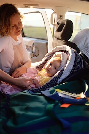 Mother with Baby in Car Seat Stock Photo - Rights-Managed, Code: 700-00196418