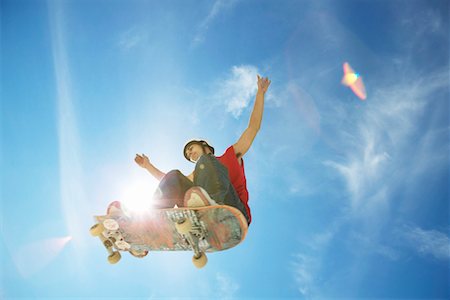 Skateboarder in Mid-air Foto de stock - Con derechos protegidos, Código: 700-00197319