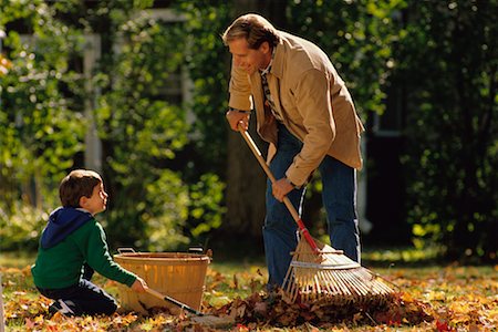 raking leaves - Father and Son Raking Leaves Stock Photo - Rights-Managed, Code: 700-00197472