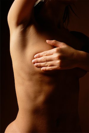 simsearch:700-00342367,k - Woman Performing Self Breast Exam Stock Photo - Rights-Managed, Code: 700-00197802