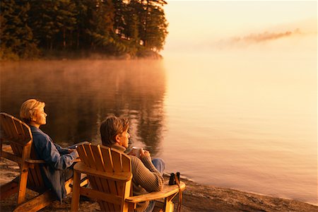 Couple Sitting in Adirondack Chairs Stock Photo - Rights-Managed, Code: 700-00198235