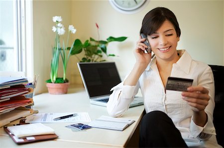 Woman on Phone with Credit Card Stock Photo - Rights-Managed, Code: 700-00198675