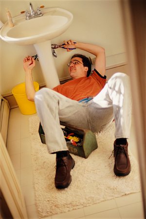 simsearch:640-02773025,k - Man Fixing Sink Stock Photo - Rights-Managed, Code: 700-00198901