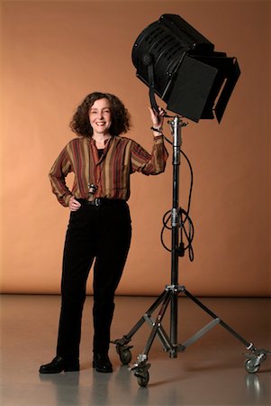 people and film production - Woman with Lighting Equipment Stock Photo - Rights-Managed, Code: 700-00199096