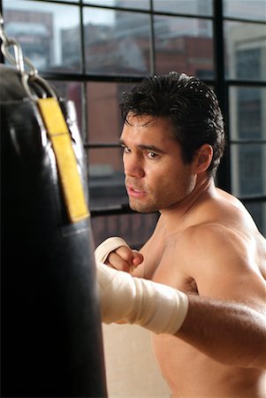 simsearch:700-00688654,k - Man Punching Punching Bag Stock Photo - Rights-Managed, Code: 700-00199101