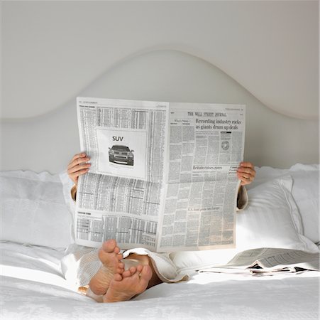 simsearch:700-00062758,k - Woman Lying in Bed Reading the Newspaper Stock Photo - Rights-Managed, Code: 700-00199896