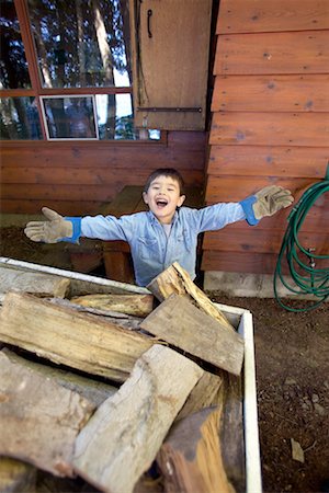 fire wood in canada - Boy at Cottage Stock Photo - Rights-Managed, Code: 700-00190298