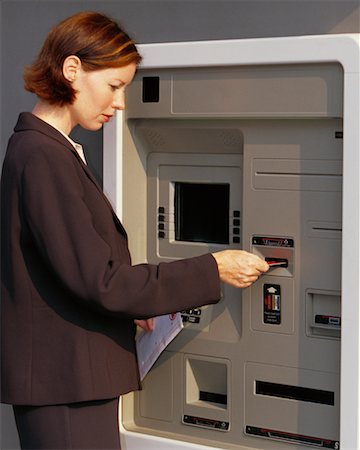 Woman Using ATM Machine Stock Photo - Rights-Managed, Code: 700-00190366