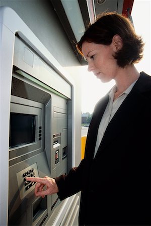 Woman Using ATM Machine Stock Photo - Rights-Managed, Code: 700-00190367