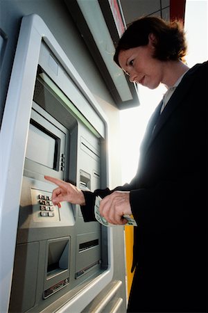 Woman Using ATM Machine Stock Photo - Rights-Managed, Code: 700-00190368