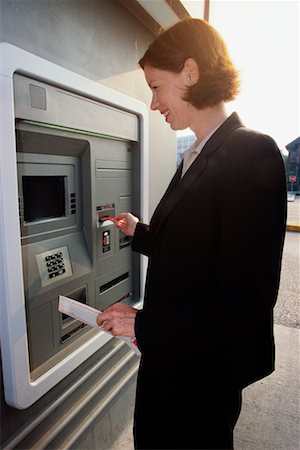 Woman Using ATM Machine Stock Photo - Rights-Managed, Code: 700-00190369