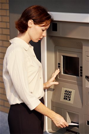 Woman Using ATM Machine Stock Photo - Rights-Managed, Code: 700-00190370