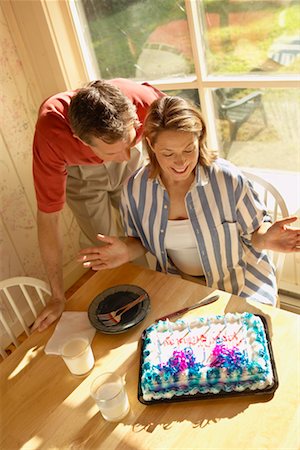 Man Surprising Woman with Birthday Cake Stock Photo - Rights-Managed, Code: 700-00190634
