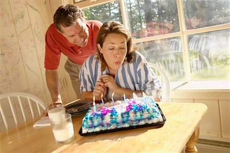 simsearch:600-00060932,k - Man Surprising Woman with Birthday Cake Stock Photo - Rights-Managed, Code: 700-00190632