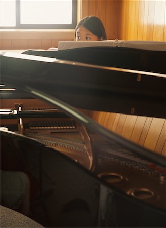 Girl Sitting Behind Piano Stock Photo - Rights-Managed, Code: 700-00190875