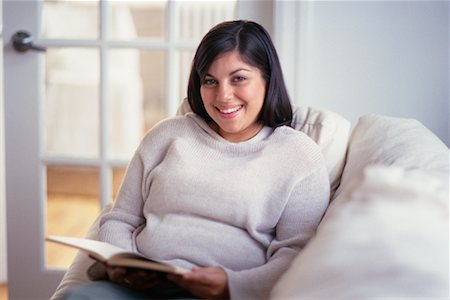 Woman Reading on Sofa Stock Photo - Rights-Managed, Code: 700-00193403