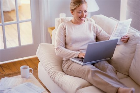 Woman Using Laptop at Home Stock Photo - Rights-Managed, Code: 700-00193416