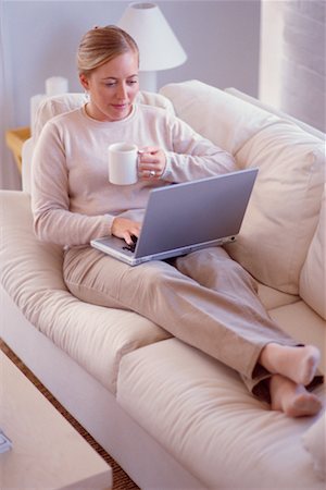 Woman Using Laptop at Home Stock Photo - Rights-Managed, Code: 700-00193417