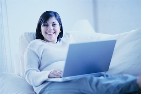 Woman on Sofa Using Laptop Stock Photo - Rights-Managed, Code: 700-00193444
