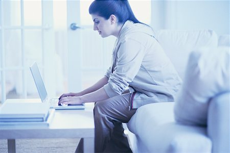 fat 20 year old woman - Woman on Sofa Using Laptop Stock Photo - Rights-Managed, Code: 700-00193447