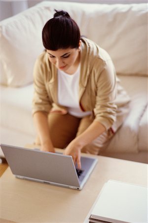 fat 20 year old woman - Woman Using Laptop Stock Photo - Rights-Managed, Code: 700-00193449
