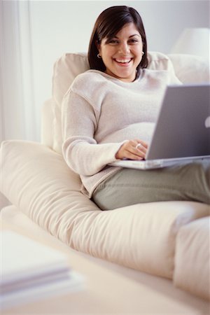 Woman on Sofa Using Laptop Stock Photo - Rights-Managed, Code: 700-00193440