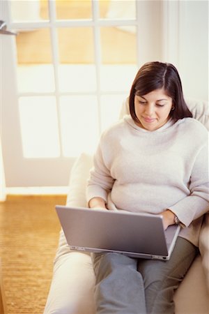 simsearch:700-00193403,k - Woman on Sofa Using Laptop Stock Photo - Rights-Managed, Code: 700-00193441
