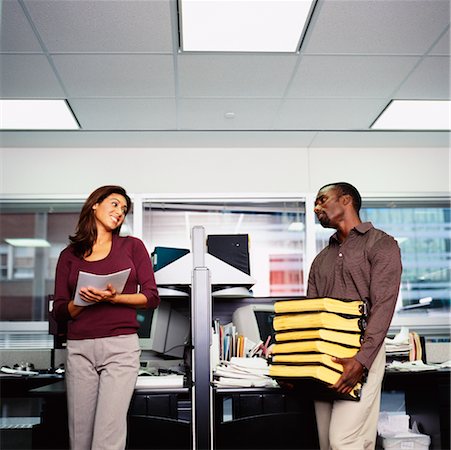 Businessman and Woman Working in Office Foto de stock - Con derechos protegidos, Código: 700-00193601