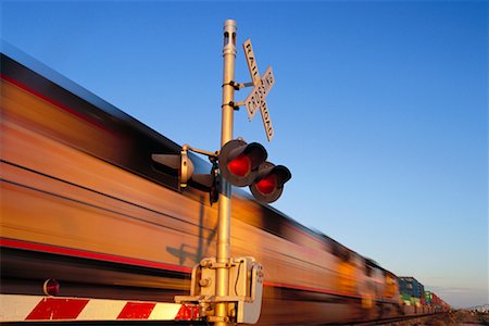 railroad crossing sign - Moving Train at Railroad Crossing Stock Photo - Rights-Managed, Code: 700-00193667