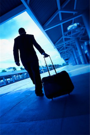 Businessman with Luggage at Train Station Foto de stock - Con derechos protegidos, Código: 700-00193991