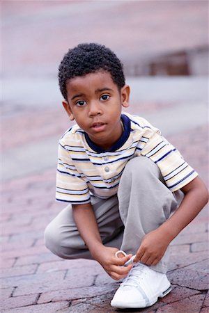 Boy deals tying shoes