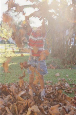 simsearch:640-01351210,k - Boy Playing in Leaves Stock Photo - Rights-Managed, Code: 700-00268062