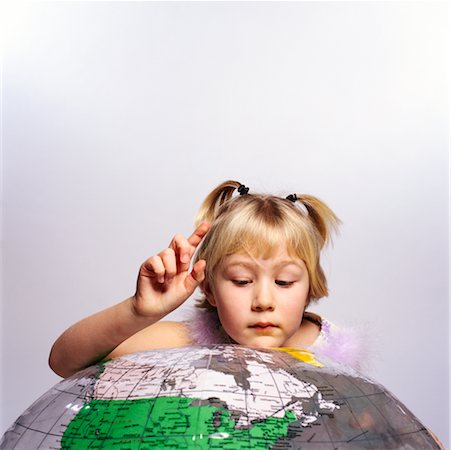 find us - Girl Looking at Globe Stock Photo - Rights-Managed, Code: 700-00268155