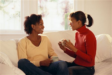 parent talking to their 16 year old - Mother and Daughter on Sofa Stock Photo - Rights-Managed, Code: 700-00268431