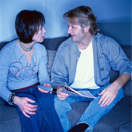 Couple on Sofa with TV Remote Stock Photo - Rights-Managed, Code: 700-00268465