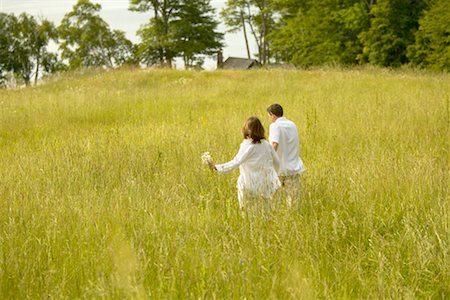 peter barrett woman 40 year old - Couple Running Through Field Stock Photo - Rights-Managed, Code: 700-00268502